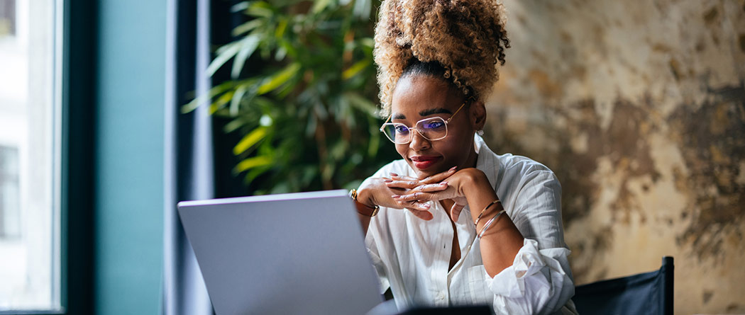 Woman working on laptop in office