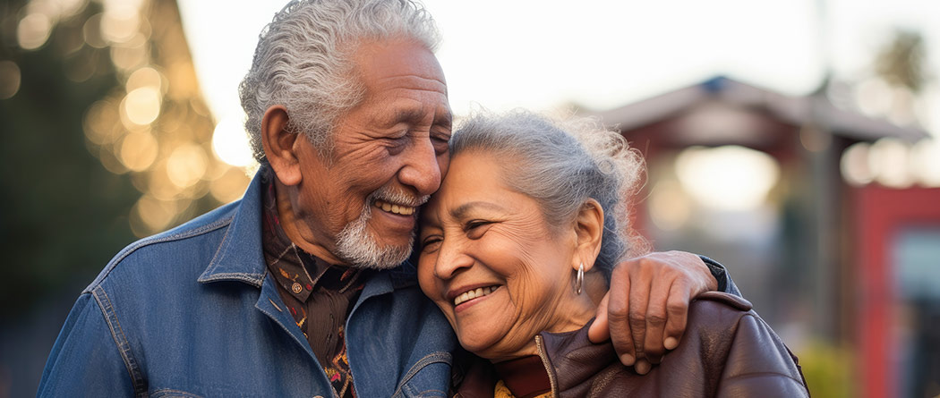 Mature couple smiling while hugging each other